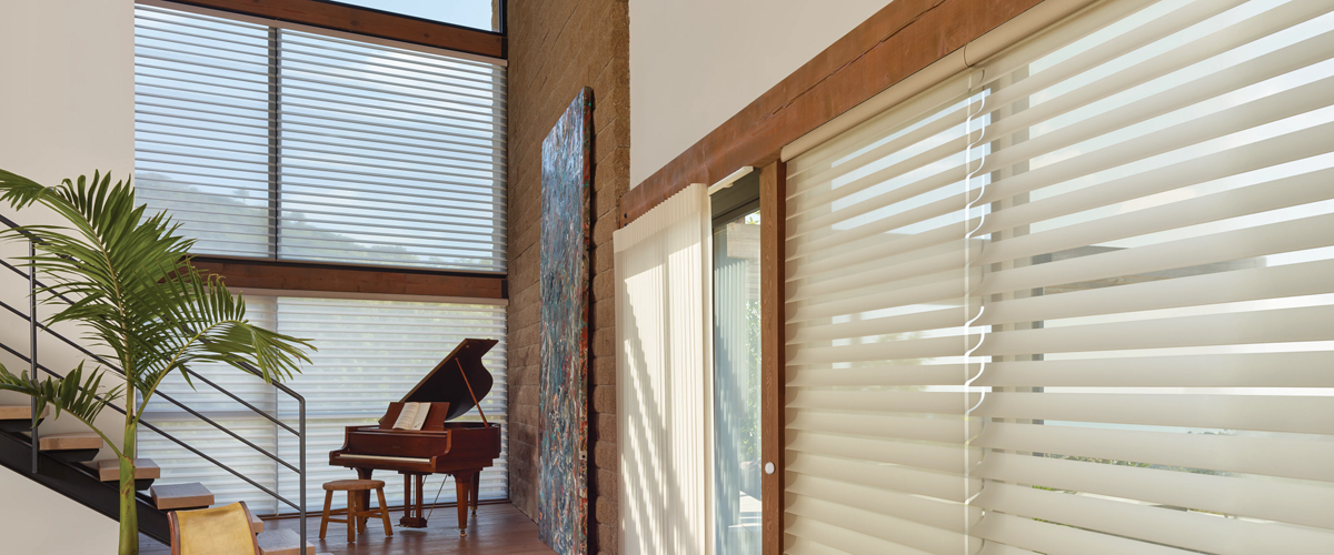 Aluminum blinds in living room with brick wall.